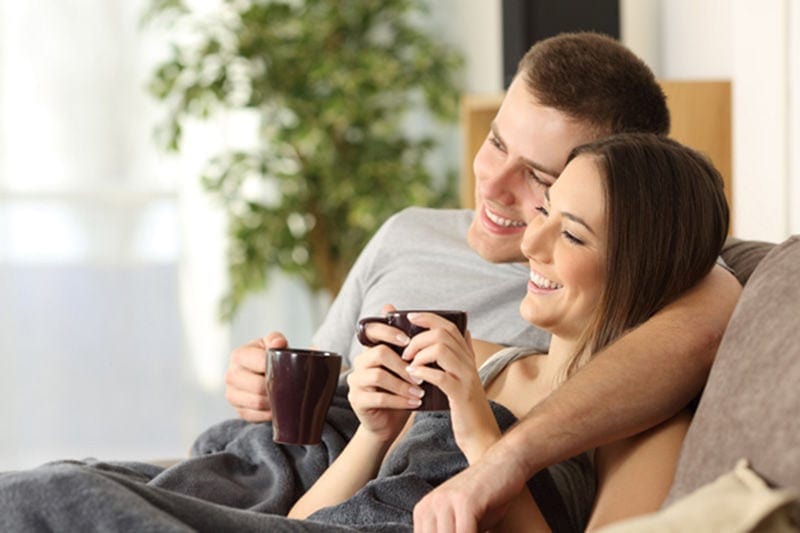 happy couple on couch