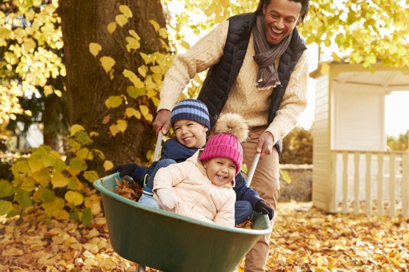 Father and Kids Playing in the Fall