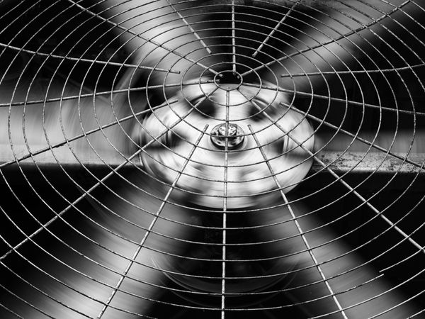 Close up shot of air conditioner unit fans running.|